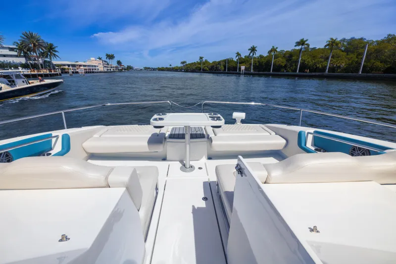 Slide: The Image of Aquila 36 Sport 2019 yacht with spacious deck and seating, cruising on a scenic waterway. - 20