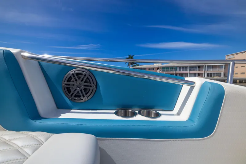 Slide: The Image of Aquila 36 Sport 2019 boat interior with blue accents and cup holders. - 21
