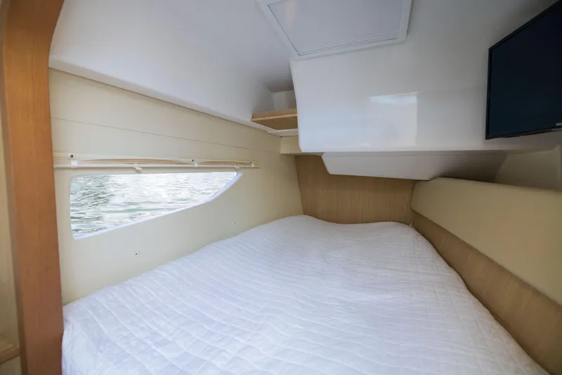 Slide: The Image of Interior cabin of 2019 Aquila 36 Sport with bed and window view. - 25