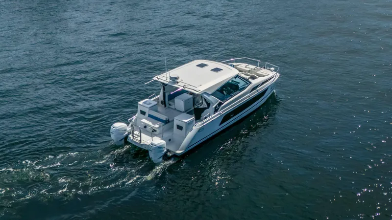 Slide: The Image of Aquila 36 Sport 2019 cruising on open water, showcasing sleek design and twin engines. - 5