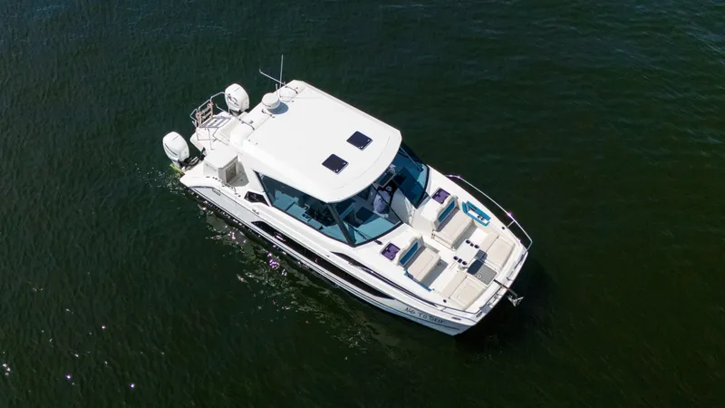 Slide: The Image of Aerial view of 2019 Aquila 36 Sport boat cruising on open water. - 6