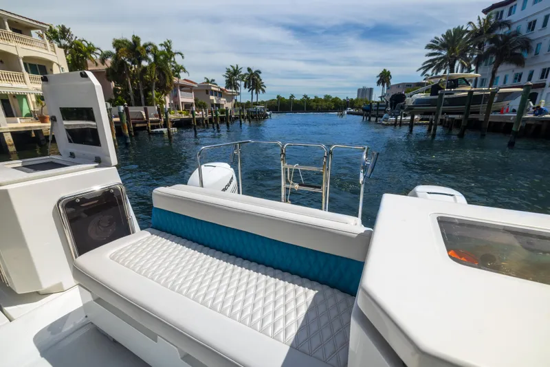 Slide: The Image of Aquila 36 Sport 2019 boat interior with waterfront view, featuring luxurious seating and modern design. - 7