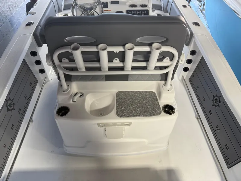 Slide: The Image of 2025 NauticStar 251 Hybrid boat interior with rod holders and seating. - 10