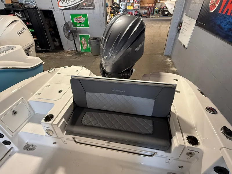 Slide: The Image of 2025 NauticStar 251 Hybrid boat with Yamaha engine, featuring cushioned seating. - 3