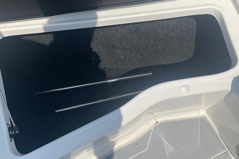 Slide: The Image of Storage compartment of 2025 Regal LS4 Surf boat with metal rods inside. - 10