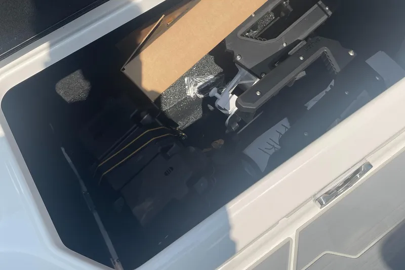 Slide: The Image of Storage compartment of 2025 Regal LS4 Surf boat with equipment and accessories. - 16