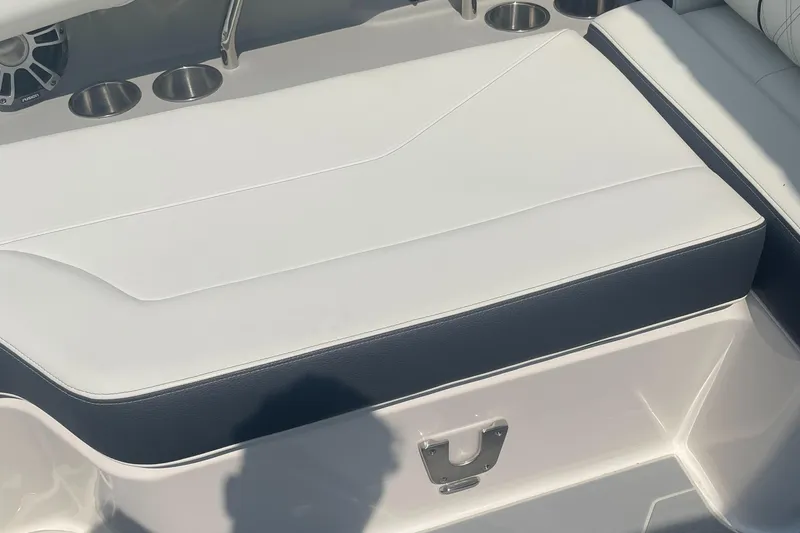 Slide: The Image of 2025 Regal LS4 Surf boat seating with cup holders and sleek design. - 17