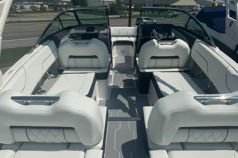 Slide: The Image of 2025 Regal LS4 Surf boat interior with luxurious white seating and modern design. - 4