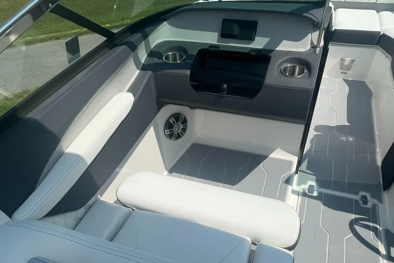 Slide: The Image of 2025 Regal LS4 Surf boat interior with white seating and modern dashboard. - 5