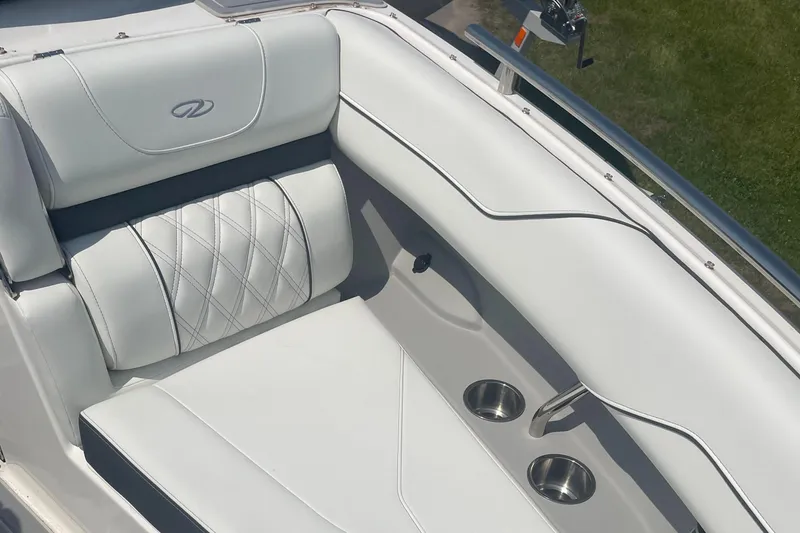 Slide: The Image of Luxurious seating in the 2025 Regal LS4 Surf boat with cup holders and elegant stitching. - 8