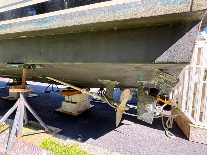 Slide: The Image of 1984 Viking Express Cruiser on stands, showing propeller and hull details. - 13