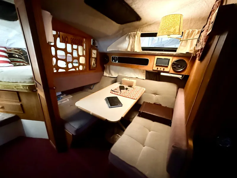 Slide: The Image of 1986 Cruisers Yachts 297 Elegante cabin interior with cozy seating and table. - 14