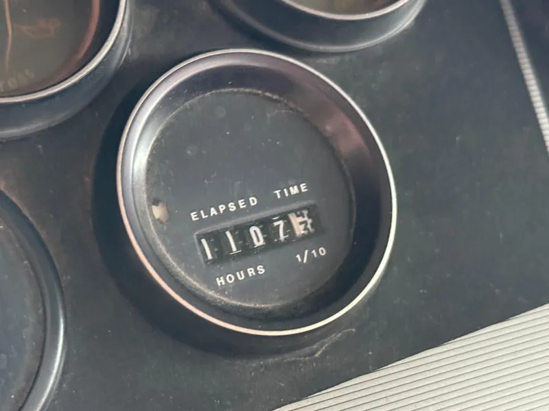 Slide: The Image of Elapsed time gauge showing 1107.4 hours on 1986 Cruisers Yachts 297 Elegante. - 21