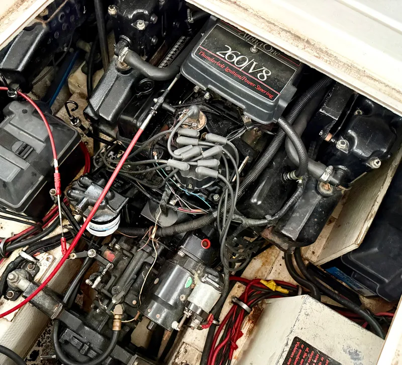 Slide: The Image of Engine compartment of a 1986 Cruisers Yachts 297 Elegante, featuring a 260 V8 engine. - 23