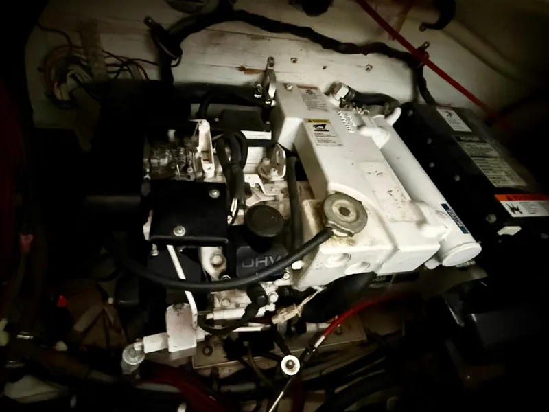 Slide: The Image of Engine compartment of 1986 Cruisers Yachts 297 Elegante, showcasing mechanical components. - 25