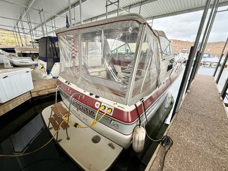 Slide: The Image of 1986 Cruisers Yachts 297 Elegante docked under a covered marina. - 3