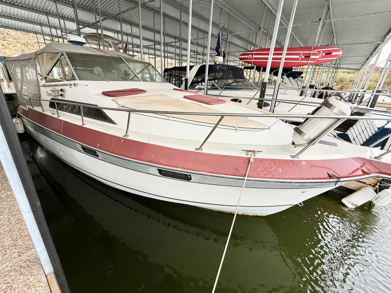 Slide: The Image of 1986 Cruisers Yachts 297 Elegante docked in a covered marina. - 4