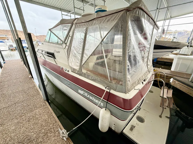 Slide: The Image of 1986 Cruisers Yachts 297 Elegante docked under a covered marina. - 5