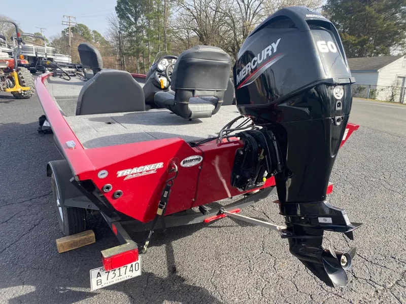 Slide: The Image of 2022 Tracker Pro Team 175 TXW boat with Mercury 60 engine, parked outdoors. - 11