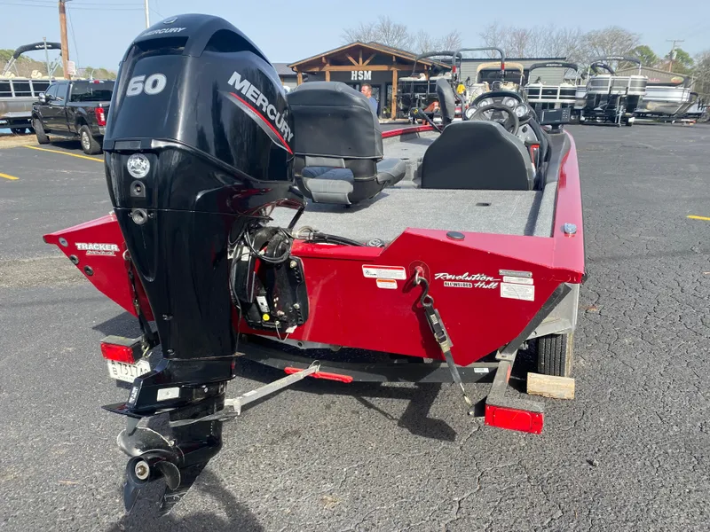 Slide: The Image of 2022 Tracker Pro Team 175 TXW boat with Mercury 50 engine, parked outdoors. - 12