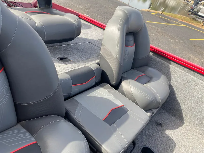 Slide: The Image of 2022 Tracker Pro Team 175 TXW boat seats with gray and red accents. - 14
