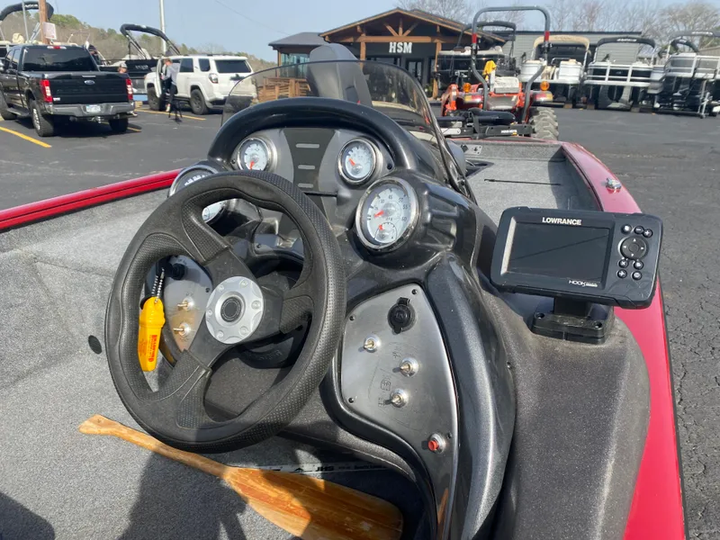 Slide: The Image of 2022 Tracker Pro Team 175 TXW boat dashboard with steering wheel and gauges. - 20