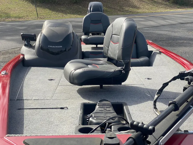 Slide: The Image of 2022 Tracker Pro Team 175 TXW boat interior with seating and controls. - 22