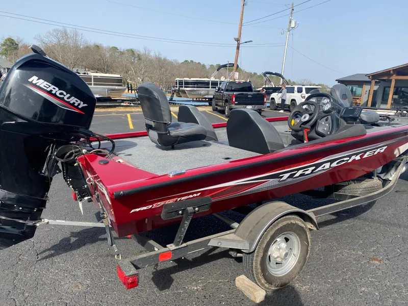 Slide: The Image of 2022 Tracker Pro Team 175 TXW boat with Mercury engine, parked on a trailer. - 3