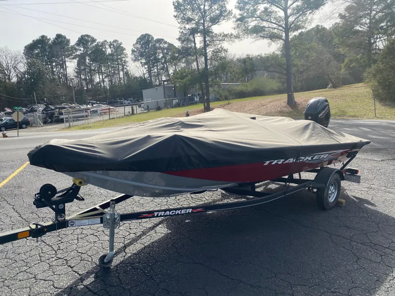 Slide: The Image of 2022 Tracker Pro Team 175 TXW boat covered on trailer in outdoor setting. - 7