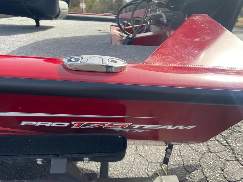 Slide: The Image of 2022 Tracker Pro Team 175 TXW boat, red exterior, close-up view. - 9