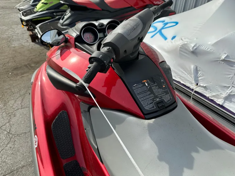 Slide: The Image of 2009 Yamaha WaveRunner FZS in red, close-up of handlebars and seat. - 1