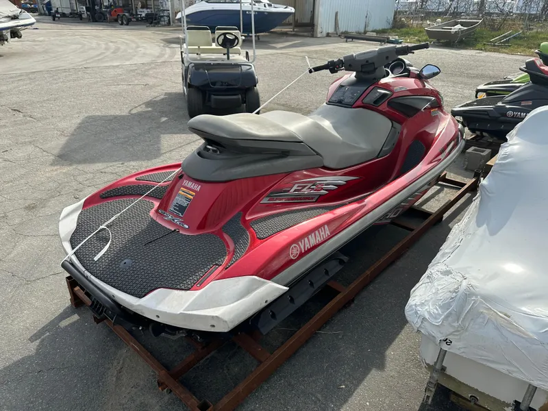 Slide: The Image of 2009 Yamaha WaveRunner FZS in red, parked outdoors on a trailer. - 3