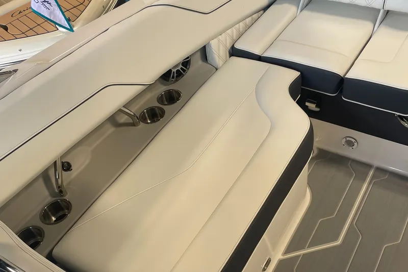 Slide: The Image of 2025 Regal LS4 Surf boat interior with sleek seating and cup holders. - 5