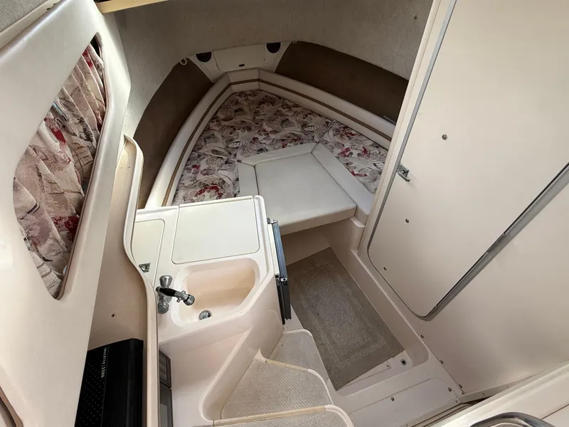 Slide: The Image of 2001 Grady-White Sailfish 274 cabin interior with sink and patterned cushions. - 20
