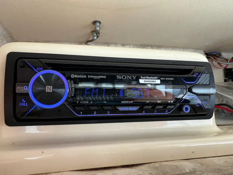 Slide: The Image of Sony Bluetooth stereo system on 2001 Grady-White Sailfish 274 boat dashboard. - 24