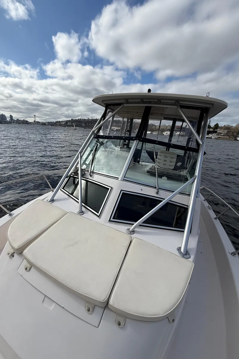 Slide: The Image of 2001 Grady-White Sailfish 274 boat on water under cloudy sky. - 36