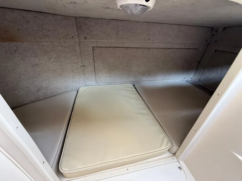 Slide: The Image of 2001 Grady-White Sailfish 274 cabin interior with cushioned seating. - 37