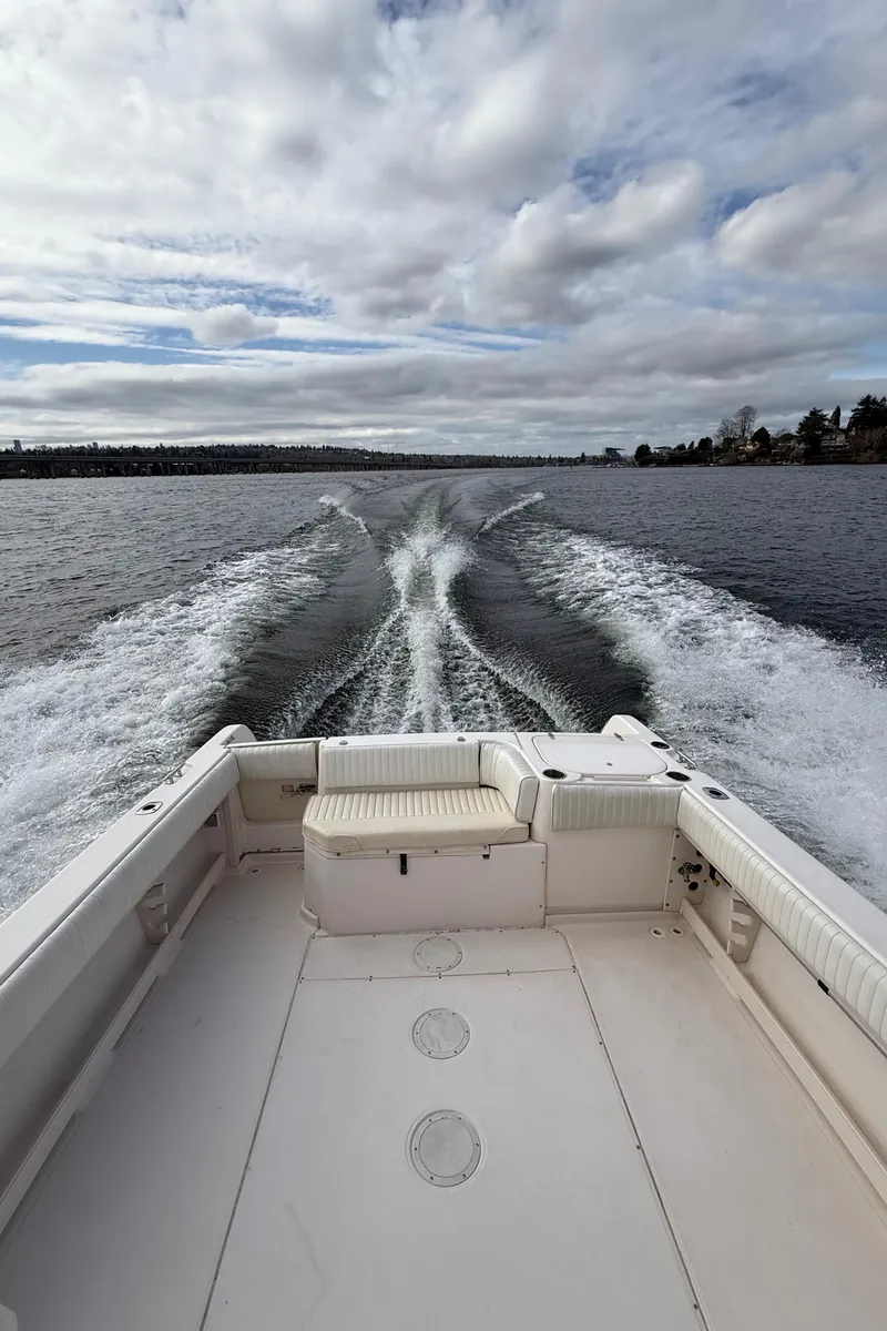 Slide: The Image of 2001 Grady-White Sailfish 274 cruising on open water under cloudy skies. - 41