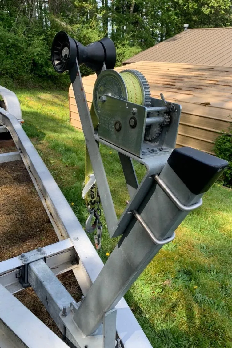 Slide: The Image of Boat trailer winch system for 1999 Grady-White Sailfish 274, set in a grassy yard. - 45