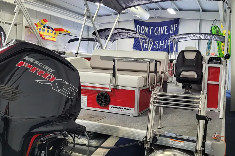 Slide: The Image of 2025 Princecraft Vectra 21 RL pontoon boat with Mercury Pro XS engine in showroom. - 10