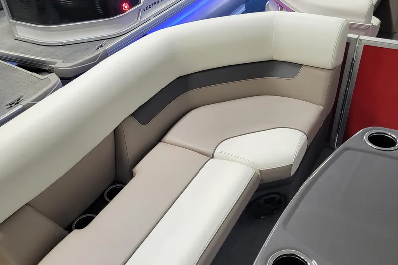 Slide: The Image of 2025 Princecraft Vectra 21 RL boat interior with beige seating and cup holders. - 4