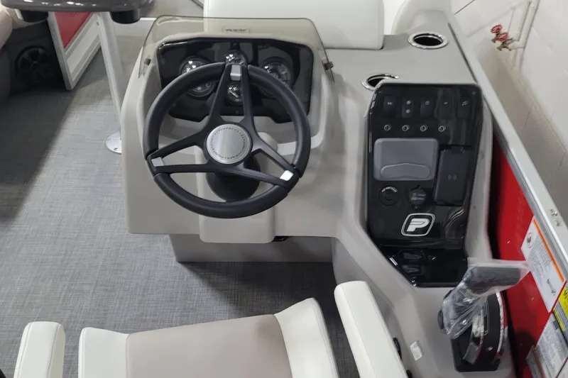 Slide: The Image of 2025 Princecraft Vectra 21 RL boat dashboard with steering wheel and controls. - 8