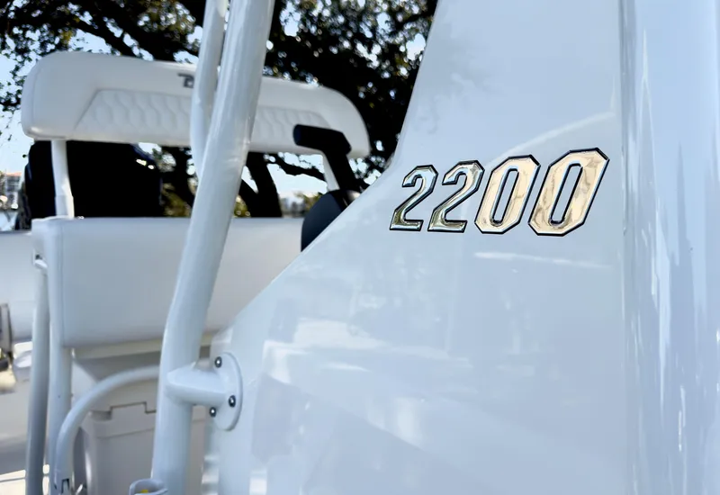 Slide: The Image of 2025 Pathfinder 2200TRS boat, close-up of model number on sleek white surface. - 13