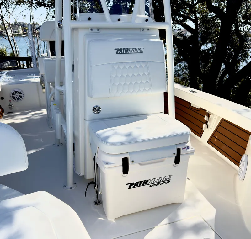 Slide: The Image of 2025 Pathfinder 2200TRS boat interior with seating and storage compartments. - 14