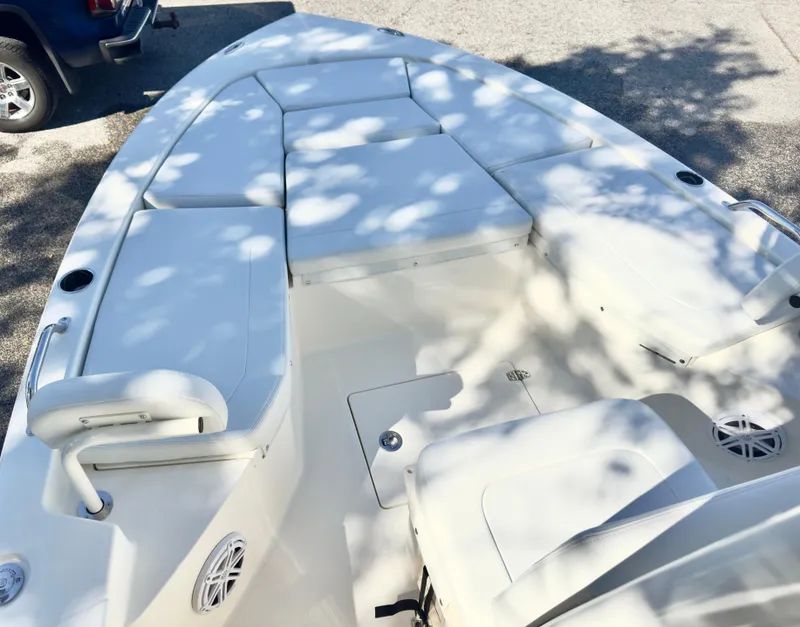 Slide: The Image of 2025 Pathfinder 2200TRS boat interior with cushioned seating and storage compartments. - 15