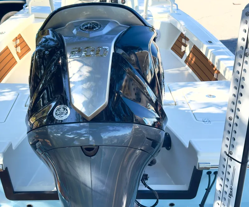 Slide: The Image of 2025 Pathfinder 2200TRS boat with powerful outboard motor, sleek design, and spacious deck. - 4