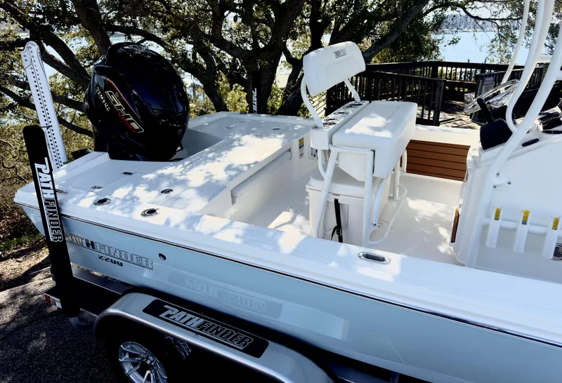 Slide: The Image of 2025 Pathfinder 2200TRS boat on trailer, featuring sleek design and modern outboard motor. - 5