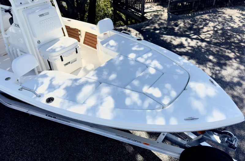 Slide: The Image of 2025 Pathfinder 2200TRS boat on trailer, featuring spacious deck and seating. - 6