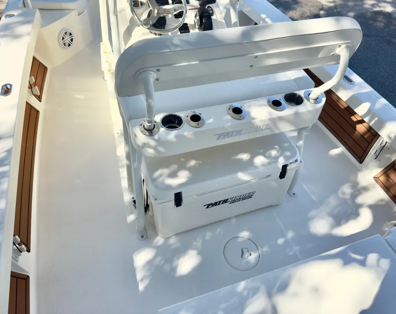 Slide: The Image of 2025 Pathfinder 2200TRS boat interior with seating and storage compartments. - 9