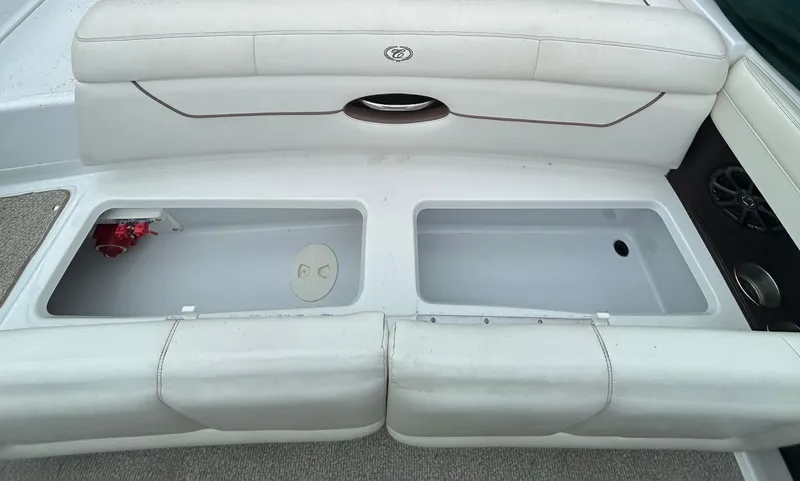 Slide: The Image of 2012 Cobalt 210 WSS boat interior with open storage compartments. - 10